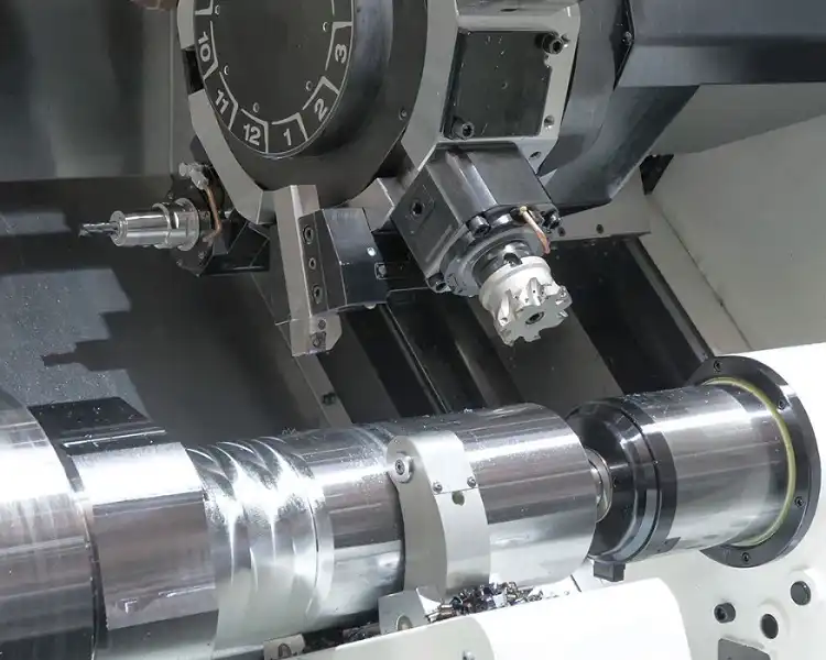 Close‑up view of CNC lathe turning metal shaft workpiece in factory workshop