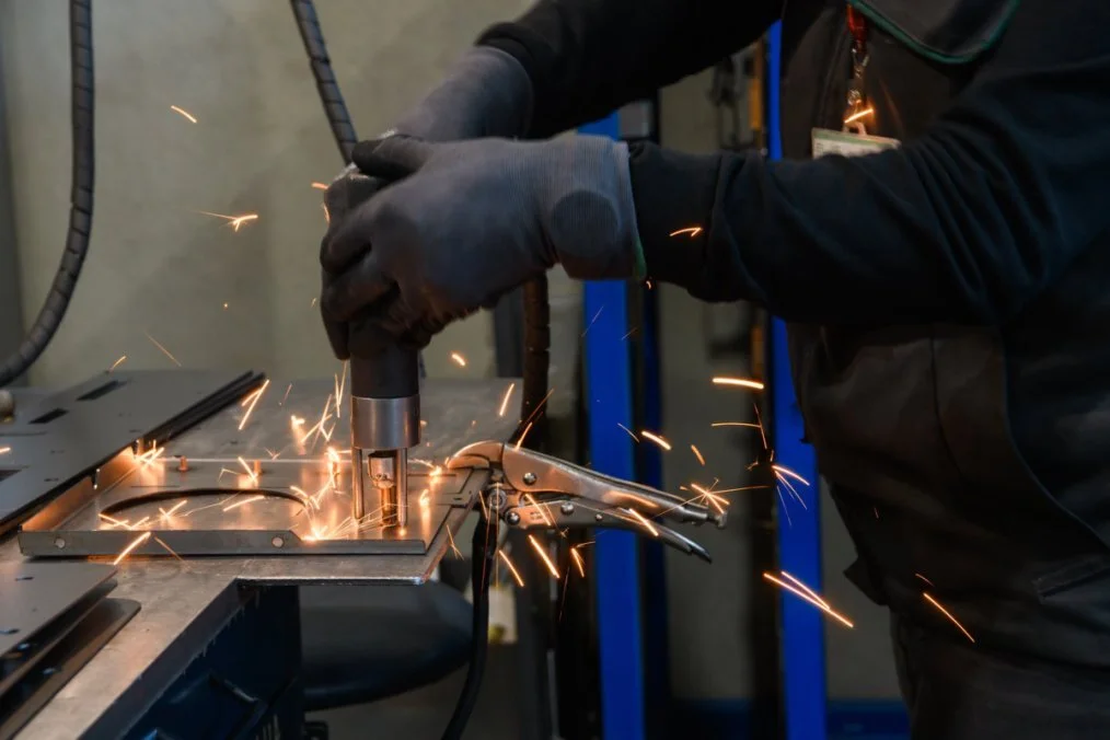 CNC milling operation with cutting sparks, removing material from metal workpiece CNC milling operation with cutting sparks, removing material from metal workpiece