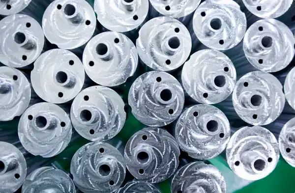 Batch of circular CNC milled metal components, flanges and discs with precise holes Batch of circular CNC milled metal components, flanges and discs with precise holes